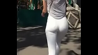 Voyeuristic View Of A Woman'S Rear End In Public